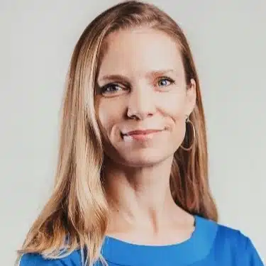 Smiling woman in blue shirt