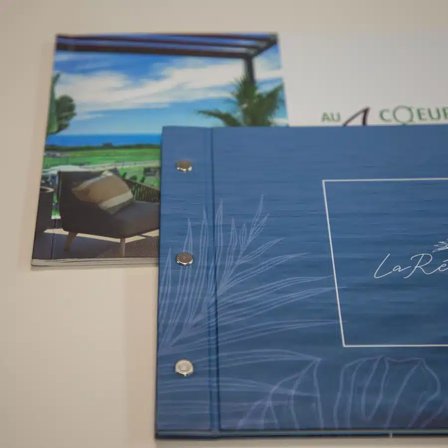 Luxury resort brochures on display.