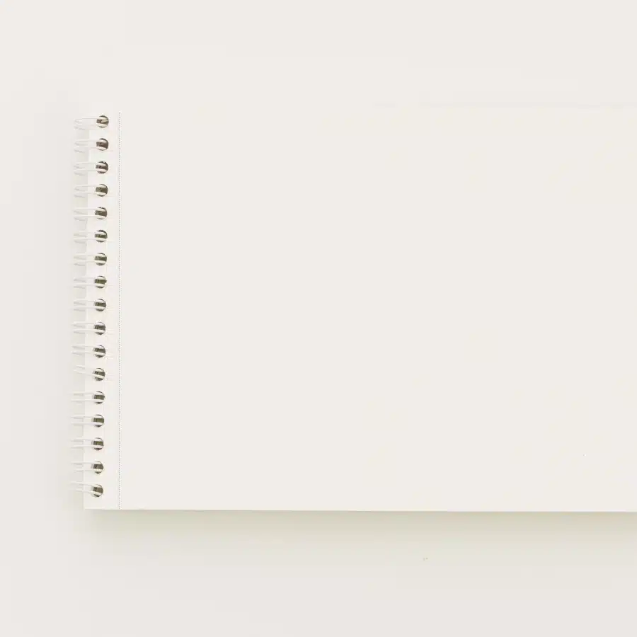 Blank spiral notebook on a white background.