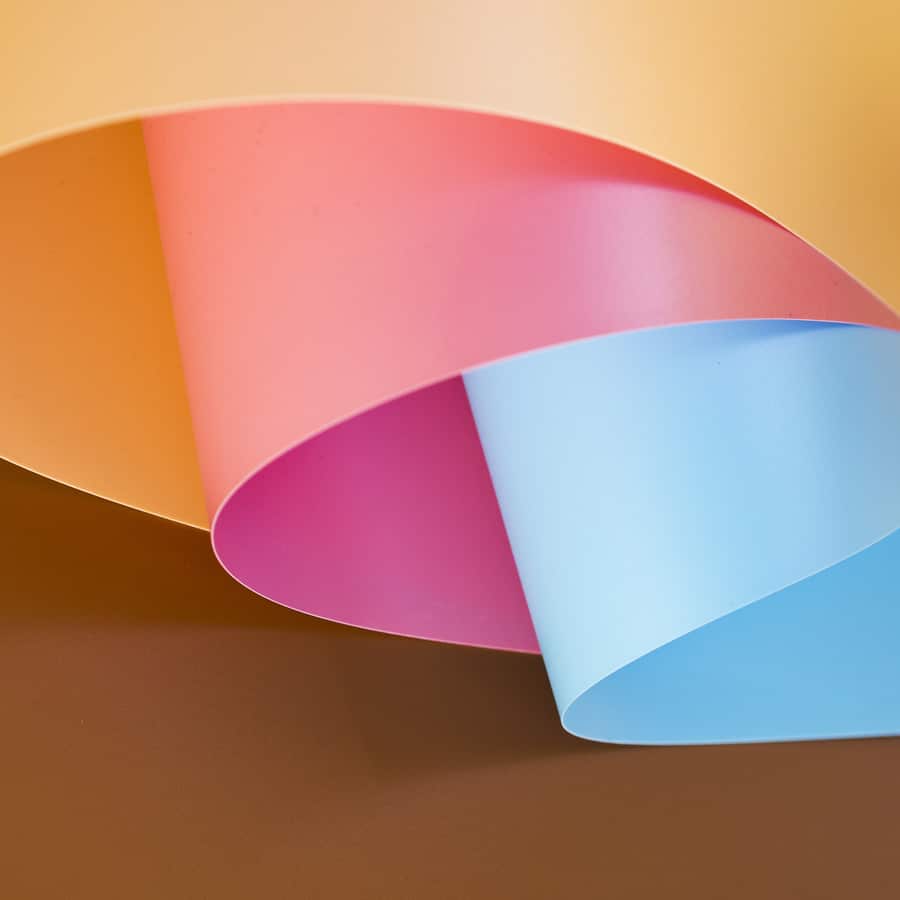 high angle vibrant bent paper sheets (1)